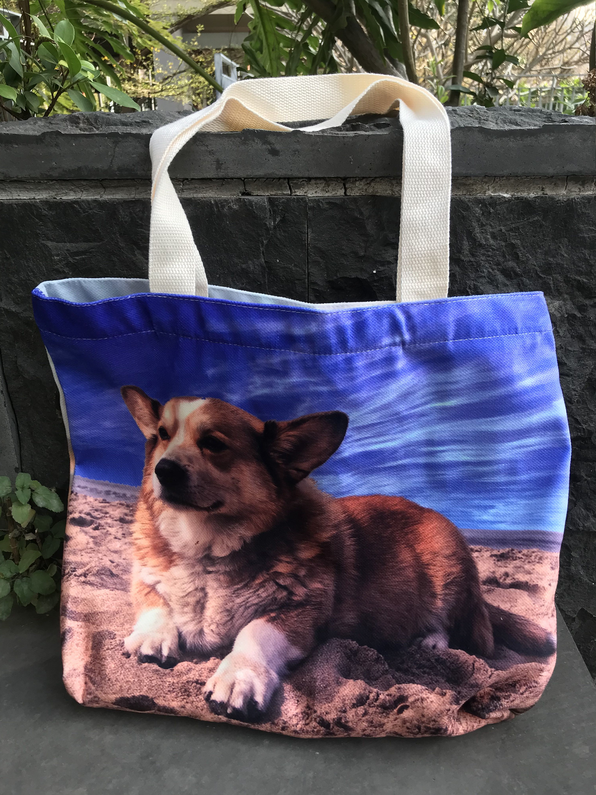 A all over print custom tote bag with a photo of a dog under the blue sky is a thoughtful and unique gift. The bag is large enough and perfect for daily.