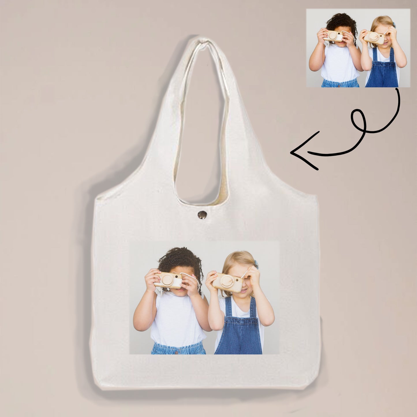 A simple but elegant tote bag that is printed with a photo of a boy and a girl is made of canvas.