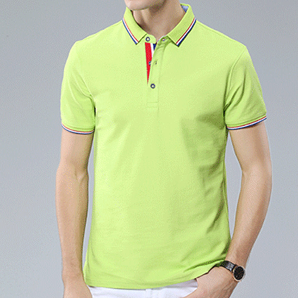 A photo of a man stands and displays a bright light green personalized polo shirt.