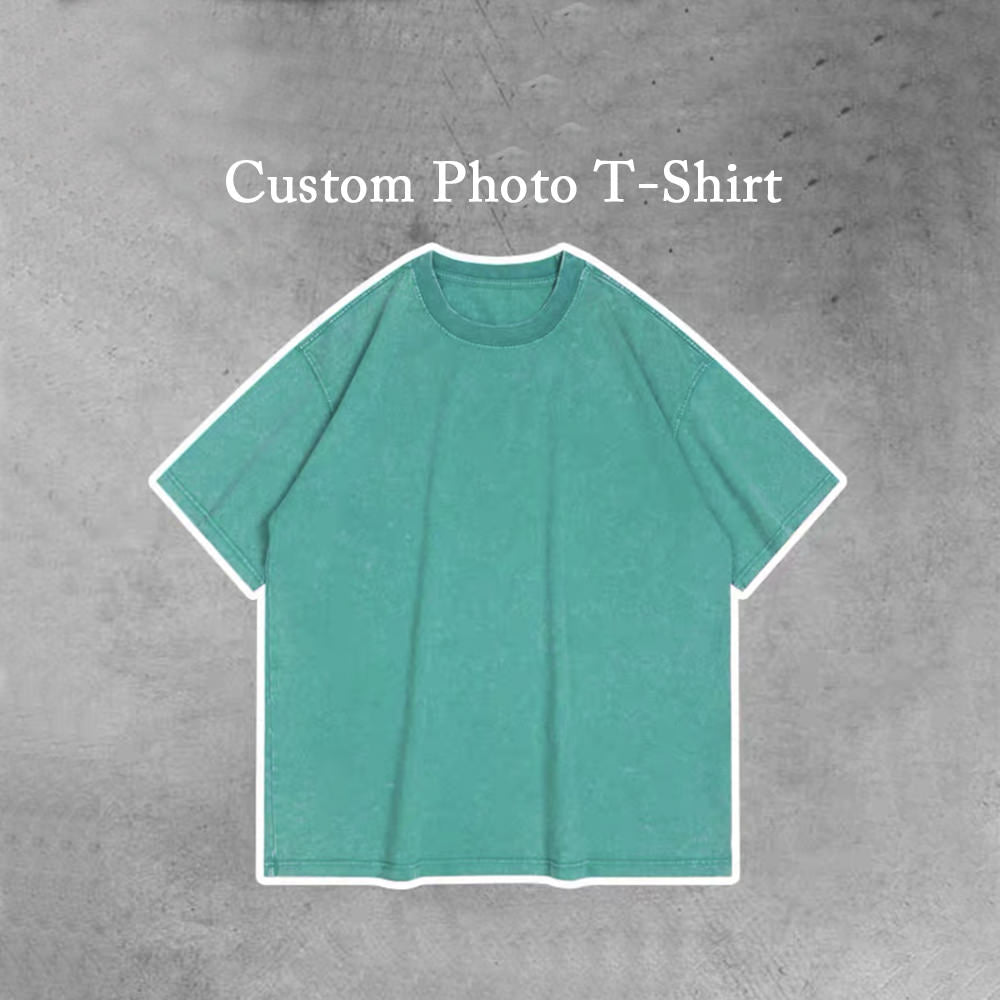 A photo of a plain solid green t-shirt with the words "Custom Photo T-Shirt" printed on the top. The t-shirt is available in personality.