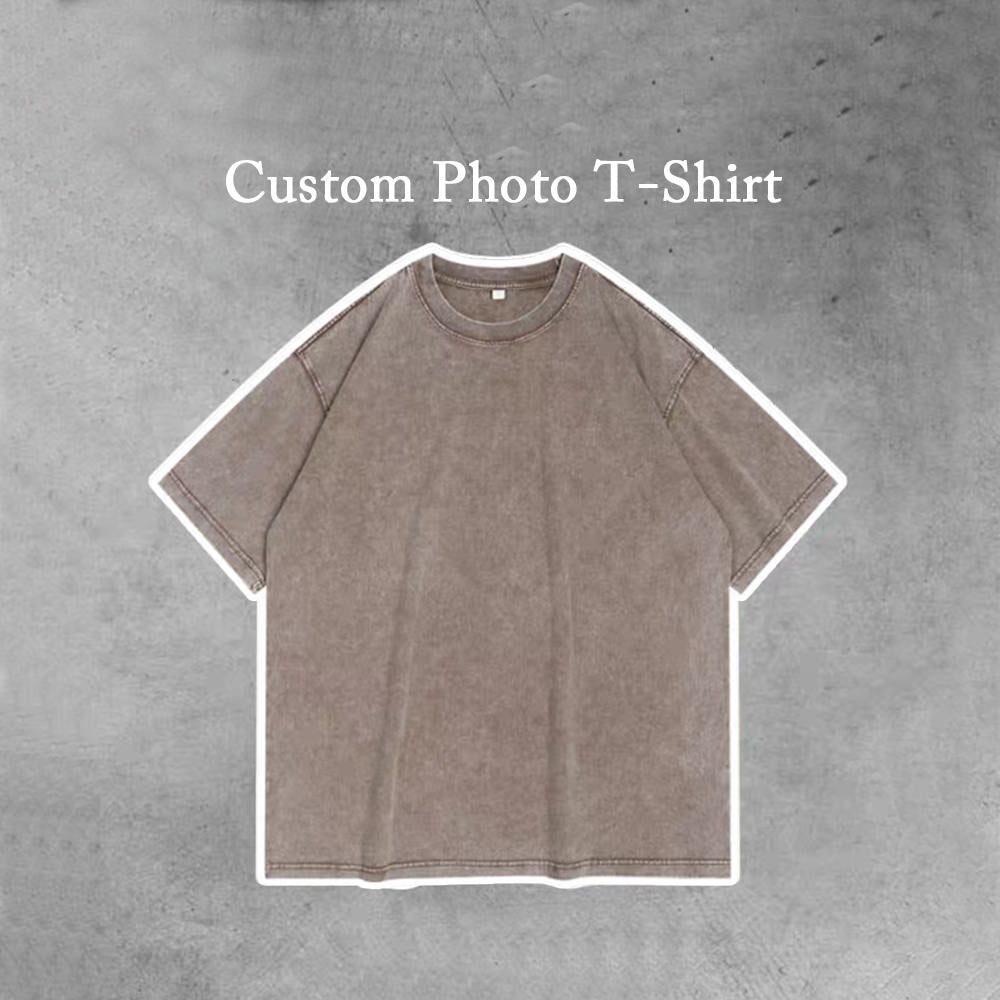 A photo of a plain solid coffee t-shirt with the words "Custom Photo T-Shirt" printed on the top. The t-shirt is available in personality.