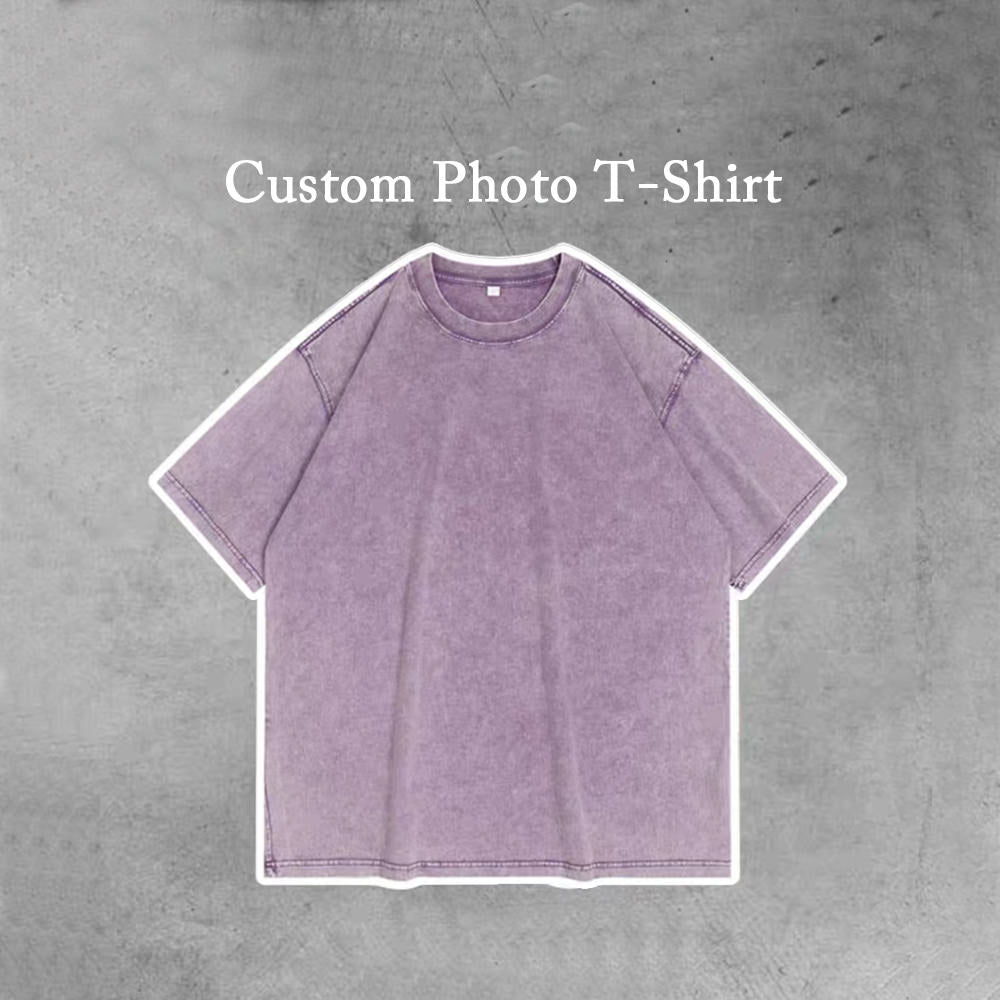 A photo of a plain solid purple t-shirt with the words "Custom Photo T-Shirt" printed on the top. The t-shirt is available in personality.