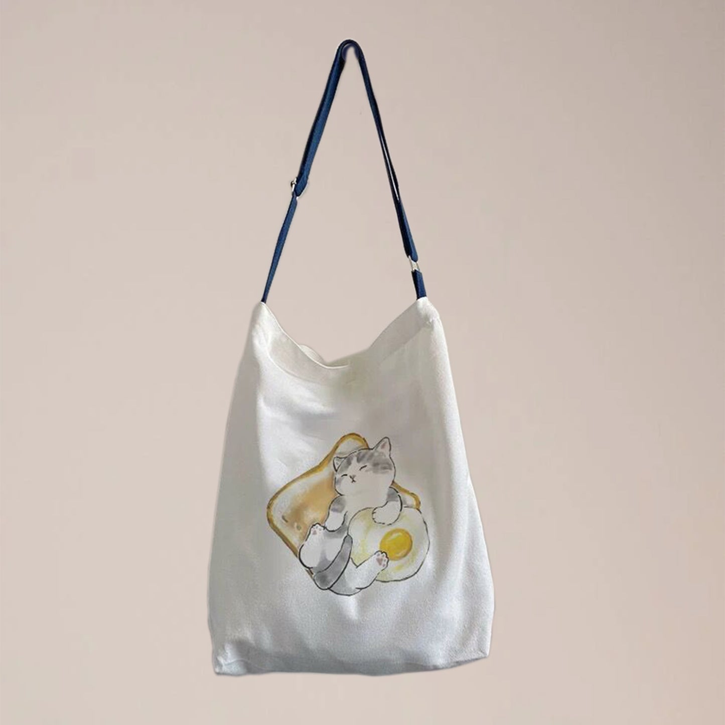 A white canvas gift crossbody and tote dual uses bag is customized with a photo on it. This crossbody bag has a length adjustable strap, which makes it can be use as a messenger bag, tote bag, crossbody bag, handbag, etc. 