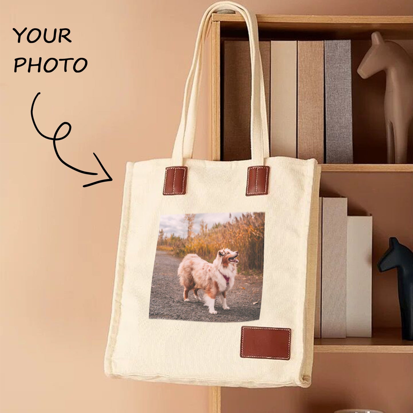 A personalized tote bag with a photo of a dog on it hangs on the bookshelf. The tote bag is thick and in good shape.